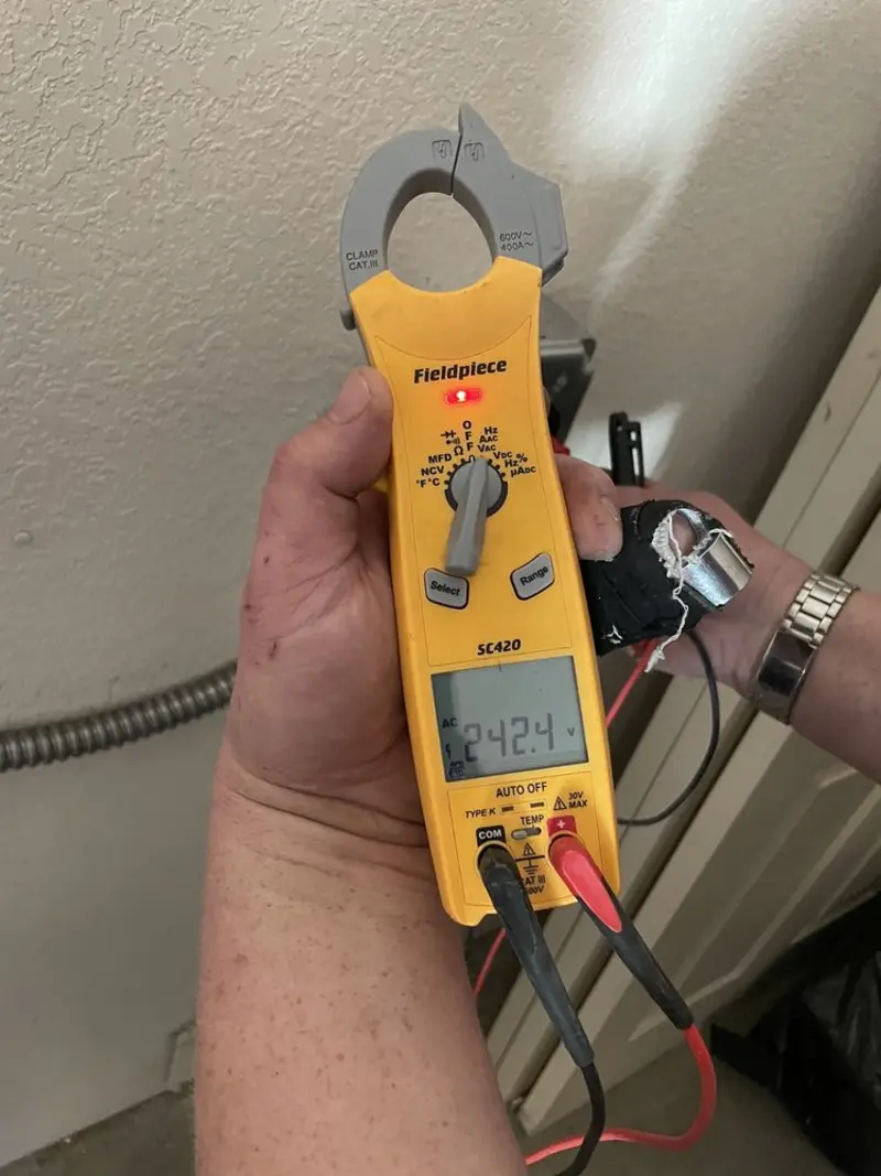 Voltage testing with clamp meter during Outlet Installation in Rose